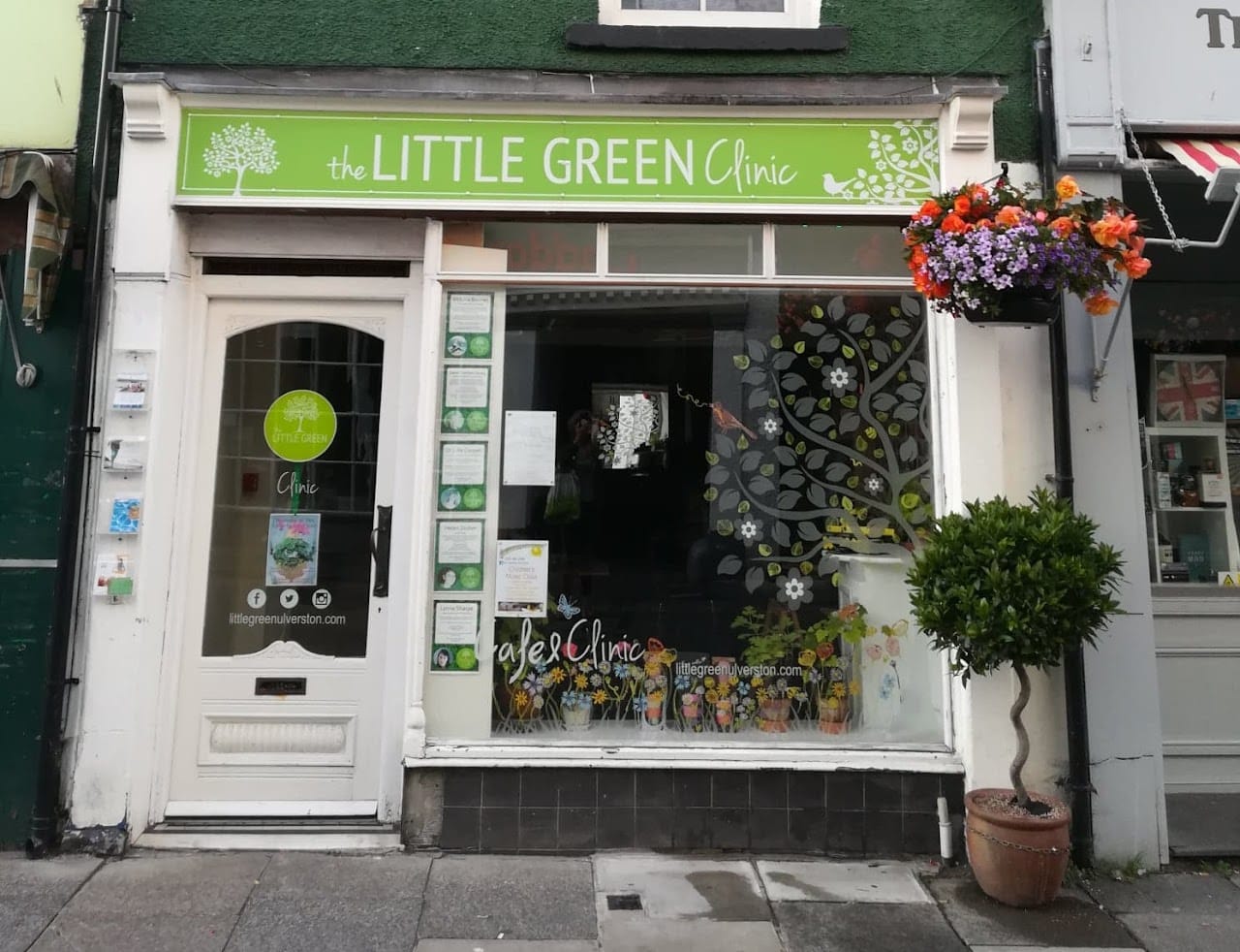 A photograph of the shop window decorated with plants